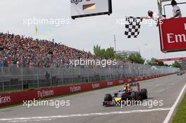 Race winner Daniel Ricciardo (AUS) Red Bull Racing RB10 takes the chequered flag at the end of the race. 08.06.2014. Formula 1 World Championship, Rd 7, Canadian Grand Prix, Montreal, Canada, Race Day.