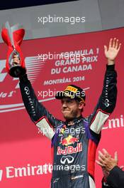 Sebastian Vettel (GER) Red Bull Racing celebrates his third position on the podium. 08.06.2014. Formula 1 World Championship, Rd 7, Canadian Grand Prix, Montreal, Canada, Race Day.