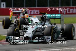 Nico Rosberg (GER), Mercedes AMG F1 Team and Sergio Perez (MEX), Sahara Force India  08.06.2014. Formula 1 World Championship, Rd 7, Canadian Grand Prix, Montreal, Canada, Race Day.