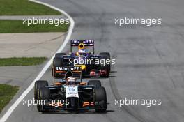 Nico Hulkenberg (GER) Sahara Force India F1 VJM07 leads Sebastian Vettel (GER) Red Bull Racing RB10. 08.06.2014. Formula 1 World Championship, Rd 7, Canadian Grand Prix, Montreal, Canada, Race Day.