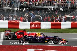 Daniel Ricciardo (AUS) Red Bull Racing RB10 and Fernando Alonso (ESP) Ferrari F14-T at the start of the race. 08.06.2014. Formula 1 World Championship, Rd 7, Canadian Grand Prix, Montreal, Canada, Race Day.