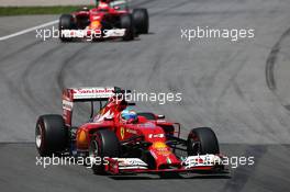 Fernando Alonso (ESP) Ferrari F14-T leads team mate Kimi Raikkonen (FIN) Ferrari F14-T. 08.06.2014. Formula 1 World Championship, Rd 7, Canadian Grand Prix, Montreal, Canada, Race Day.