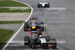 Nico Hulkenberg (GER) Sahara Force India F1 VJM07 leads Daniel Ricciardo (AUS) Red Bull Racing RB10. 08.06.2014. Formula 1 World Championship, Rd 7, Canadian Grand Prix, Montreal, Canada, Race Day.