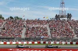 Nico Rosberg (GER) Mercedes AMG F1 W05 leads Lewis Hamilton (GBR) Mercedes AMG F1 W05. 08.06.2014. Formula 1 World Championship, Rd 7, Canadian Grand Prix, Montreal, Canada, Race Day.