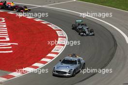 Nico Rosberg (GER) Mercedes AMG F1 W05 leads behind the FIA Safety Car. 08.06.2014. Formula 1 World Championship, Rd 7, Canadian Grand Prix, Montreal, Canada, Race Day.