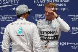 Nico Rosberg (GER) Mercedes AMG F1 (Right) celebrates his pole position with team mate Lewis Hamilton (GBR) Mercedes AMG F1. 07.06.2014. Formula 1 World Championship, Rd 7, Canadian Grand Prix, Montreal, Canada, Qualifying Day.