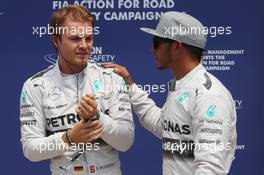 (L to R): Nico Rosberg (GER) Mercedes AMG F1 celebrates his pole position with team mate Lewis Hamilton (GBR) Mercedes AMG F1. 07.06.2014. Formula 1 World Championship, Rd 7, Canadian Grand Prix, Montreal, Canada, Qualifying Day.