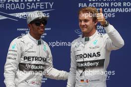 Nico Rosberg (GER) Mercedes AMG F1 (Right) celebrates his pole position with team mate Lewis Hamilton (GBR) Mercedes AMG F1. 07.06.2014. Formula 1 World Championship, Rd 7, Canadian Grand Prix, Montreal, Canada, Qualifying Day.