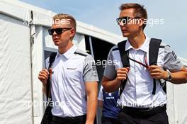 (L to R): Kevin Magnussen (DEN) McLaren with Antti Vierula (FIN) Personal Trainer. 08.06.2014. Formula 1 World Championship, Rd 7, Canadian Grand Prix, Montreal, Canada, Race Day.