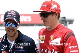 (L to R): Sebastian Vettel (GER) Red Bull Racing with Kimi Raikkonen (FIN) Ferrari on the drivers parade. 08.06.2014. Formula 1 World Championship, Rd 7, Canadian Grand Prix, Montreal, Canada, Race Day.