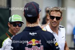 (L to R): Kamui Kobayashi (JPN) Caterham with Daniel Ricciardo (AUS) Red Bull Racing and Jenson Button (GBR) McLaren on the drivers parade. 08.06.2014. Formula 1 World Championship, Rd 7, Canadian Grand Prix, Montreal, Canada, Race Day.