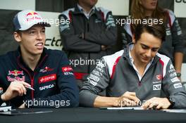 (L to R): Daniil Kvyat (RUS) Scuderia Toro Rosso and Esteban Gutierrez (MEX) Sauber sign autographs for the fans. 05.06.2014. Formula 1 World Championship, Rd 7, Canadian Grand Prix, Montreal, Canada, Preparation Day.