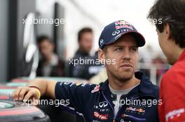 Sebastian Vettel (GER) Red Bull Racing with Massimo Rivola (ITA) Ferrari Sporting Director. 05.06.2014. Formula 1 World Championship, Rd 7, Canadian Grand Prix, Montreal, Canada, Preparation Day.