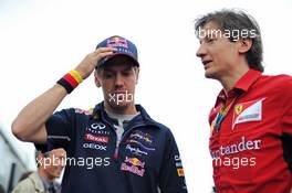 (L to R): Sebastian Vettel (GER) Red Bull Racing with Massimo Rivola (ITA) Ferrari Sporting Director. 05.06.2014. Formula 1 World Championship, Rd 7, Canadian Grand Prix, Montreal, Canada, Preparation Day.