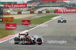Romain Grosjean (FRA) Lotus F1 E22 locks up under braking. 18.04.2014. Formula 1 World Championship, Rd 4, Chinese Grand Prix, Shanghai, China, Practice Day.