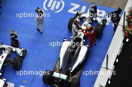 Race winner Lewis Hamilton (GBR) Mercedes AMG F1 W05 celebrates with third placed Fernando Alonso (ESP) Ferrari in parc ferme. 20.04.2014. Formula 1 World Championship, Rd 4, Chinese Grand Prix, Shanghai, China, Race Day.