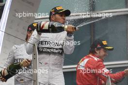 Race winner Lewis Hamilton (GBR) Mercedes AMG F1 celebrates on the podium. 20.04.2014. Formula 1 World Championship, Rd 4, Chinese Grand Prix, Shanghai, China, Race Day.