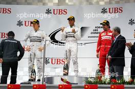 The podium (L to R): Nico Rosberg (GER) Mercedes AMG F1, second; Lewis Hamilton (GBR) Mercedes AMG F1, race winner; Fernando Alonso (ESP) Ferrari, third. 20.04.2014. Formula 1 World Championship, Rd 4, Chinese Grand Prix, Shanghai, China, Race Day.