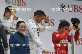 The podium (L to R): Nico Rosberg (GER) Mercedes AMG F1, second; Lewis Hamilton (GBR) Mercedes AMG F1, race winner; Fernando Alonso (ESP) Ferrari, third. 20.04.2014. Formula 1 World Championship, Rd 4, Chinese Grand Prix, Shanghai, China, Race Day.