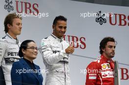 The podium (L to R): Nico Rosberg (GER) Mercedes AMG F1, second; Lewis Hamilton (GBR) Mercedes AMG F1, race winner; Fernando Alonso (ESP) Ferrari, third. 20.04.2014. Formula 1 World Championship, Rd 4, Chinese Grand Prix, Shanghai, China, Race Day.