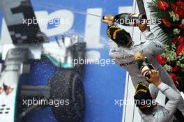 Race winner Lewis Hamilton (GBR) Mercedes AMG F1 celebrates on the podium with team mate Nico Rosberg (GER) Mercedes AMG F1. 20.04.2014. Formula 1 World Championship, Rd 4, Chinese Grand Prix, Shanghai, China, Race Day.