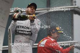 Race winner Lewis Hamilton (GBR) Mercedes AMG F1 celebrates on the podium. 20.04.2014. Formula 1 World Championship, Rd 4, Chinese Grand Prix, Shanghai, China, Race Day.