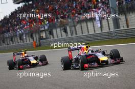 Sebastian Vettel (GER) Red Bull Racing RB10 leads team mate Daniel Ricciardo (AUS) Red Bull Racing RB10. 20.04.2014. Formula 1 World Championship, Rd 4, Chinese Grand Prix, Shanghai, China, Race Day.