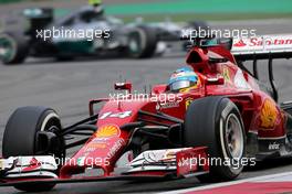 Fernando Alonso (ESP), Scuderia Ferrari and Nico Rosberg (GER), Mercedes AMG F1 Team  20.04.2014. Formula 1 World Championship, Rd 4, Chinese Grand Prix, Shanghai, China, Race Day.