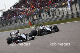 Esteban Gutierrez (MEX) Sauber C33 and Kevin Magnussen (DEN) McLaren MP4-29 battle for position. 20.04.2014. Formula 1 World Championship, Rd 4, Chinese Grand Prix, Shanghai, China, Race Day.