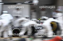 Kevin Magnussen (DEN) McLaren MP4-29 makes a pit stop. 20.04.2014. Formula 1 World Championship, Rd 4, Chinese Grand Prix, Shanghai, China, Race Day.