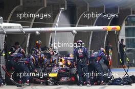 Sebastian Vettel (GER) Red Bull Racing RB10 makes a pit stop. 20.04.2014. Formula 1 World Championship, Rd 4, Chinese Grand Prix, Shanghai, China, Race Day.