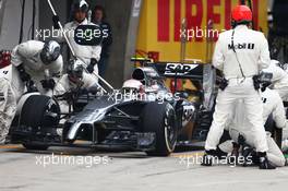 Kevin Magnussen (DEN) McLaren MP4-29 makes a pit stop. 20.04.2014. Formula 1 World Championship, Rd 4, Chinese Grand Prix, Shanghai, China, Race Day.