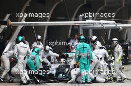 Lewis Hamilton (GBR) Mercedes AMG F1 W05 makes a pit stop. 20.04.2014. Formula 1 World Championship, Rd 4, Chinese Grand Prix, Shanghai, China, Race Day.