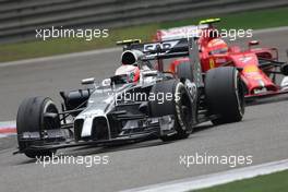 Kevin Magnussen (DEN), McLaren F1 and Kimi Raikkonen (FIN), Scuderia Ferrari  20.04.2014. Formula 1 World Championship, Rd 4, Chinese Grand Prix, Shanghai, China, Race Day.