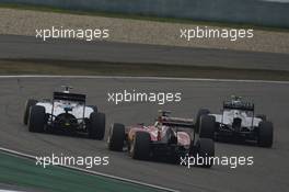 Valtteri Bottas (FIN) Williams FW36 and Kimi Raikkonen (FIN) Ferrari F14-T at the start of the race. 20.04.2014. Formula 1 World Championship, Rd 4, Chinese Grand Prix, Shanghai, China, Race Day.