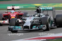 Nico Rosberg (GER), Mercedes AMG F1 Team and Fernando Alonso (ESP), Scuderia Ferrari  20.04.2014. Formula 1 World Championship, Rd 4, Chinese Grand Prix, Shanghai, China, Race Day.