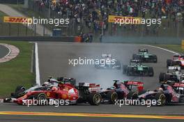 Kevin Magnussen (DEN) McLaren MP4-29 locks up under braking at the start of the race. 20.04.2014. Formula 1 World Championship, Rd 4, Chinese Grand Prix, Shanghai, China, Race Day.