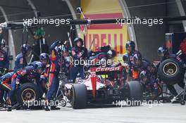 Jean-Eric Vergne (FRA) Scuderia Toro Rosso STR9 makes a pit stop. 20.04.2014. Formula 1 World Championship, Rd 4, Chinese Grand Prix, Shanghai, China, Race Day.