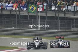 Jenson Button (GBR) McLaren MP4-29 and Jean-Eric Vergne (FRA) Scuderia Toro Rosso STR9 battle for position. 20.04.2014. Formula 1 World Championship, Rd 4, Chinese Grand Prix, Shanghai, China, Race Day.