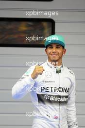 Lewis Hamilton (GBR) Mercedes AMG F1 celebrates his pole position in parc ferme. 19.04.2014. Formula 1 World Championship, Rd 4, Chinese Grand Prix, Shanghai, China, Qualifying Day.