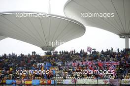 Fans and flags in the grandstand. 19.04.2014. Formula 1 World Championship, Rd 4, Chinese Grand Prix, Shanghai, China, Qualifying Day.