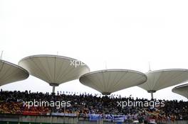 Fans in the grandstand. 19.04.2014. Formula 1 World Championship, Rd 4, Chinese Grand Prix, Shanghai, China, Qualifying Day.