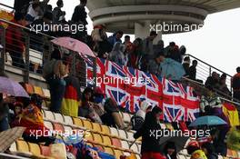 Lewis Hamilton (GBR) Mercedes AMG F1 fans and flags.