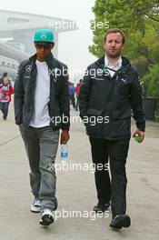 Lewis Hamilton (GBR) Mercedes AMG F1 with Bradley Lord (GBR) Mercedes AMG F1 Communications Manager. 17.04.2014. Formula 1 World Championship, Rd 4, Chinese Grand Prix, Shanghai, China, Preparation Day.