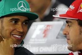 Lewis Hamilton (GBR), Mercedes AMG F1 Team and Fernando Alonso (ESP), Scuderia Ferrari at the press conference 17.04.2014. Formula 1 World Championship, Rd 4, Chinese Grand Prix, Shanghai, China, Preparation Day.