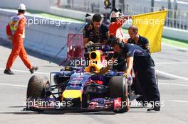 The Red Bull Racing RB10 of Sebastian Vettel (GER) Red Bull Racing is recovered back to the pits after he stopped on track in FP1. 09.05.2014. Formula 1 World Championship, Rd 5, Spanish Grand Prix, Barcelona, Spain, Practice Day.