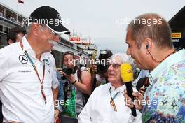 (L to R): Dr. Dieter Zetsche (GER) Daimler AG CEO with Bernie Ecclestone (GBR) and Kai Ebel (GER) RTL TV Presenter on the grid. 11.05.2014. Formula 1 World Championship, Rd 5, Spanish Grand Prix, Barcelona, Spain, Race Day.