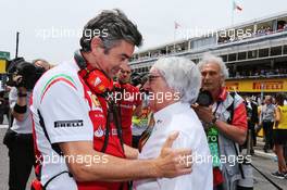 (L to R): Marco Mattiacci (ITA) Ferrari Team Principal with Bernie Ecclestone (GBR) on the grid. 11.05.2014. Formula 1 World Championship, Rd 5, Spanish Grand Prix, Barcelona, Spain, Race Day.