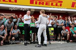 Nico Rosberg (GER) Mercedes AMG F1 celebrates his second position with Dr. Dieter Zetsche (GER) Daimler AG CEO and the team. 11.05.2014. Formula 1 World Championship, Rd 5, Spanish Grand Prix, Barcelona, Spain, Race Day.