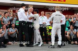 race winner Lewis Hamilton (GBR) Mercedes AMG F1 celebrates with Dr. Dieter Zetsche (GER) Daimler AG CEO, Toto Wolff (GER) Mercedes AMG F1 Shareholder and Executive Director, team mate Nico Rosberg (GER) Mercedes AMG F1 and the team. 11.05.2014. Formula 1 World Championship, Rd 5, Spanish Grand Prix, Barcelona, Spain, Race Day.